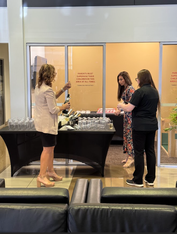 Temecula Valley Buick GMC staff pouring beverages at the 5th year anniversary celebration